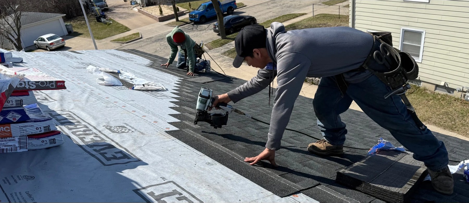 Brew City Roofing crew fastening shingles on a Milwaukee home